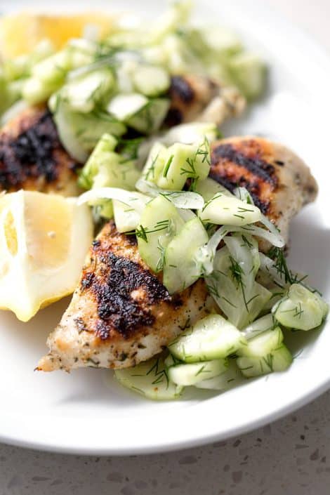 Grilled-Chicken-with-Cucumber-Dill-Salad-28sm Grilled Chicken and Cucumber Dill Salad on white background