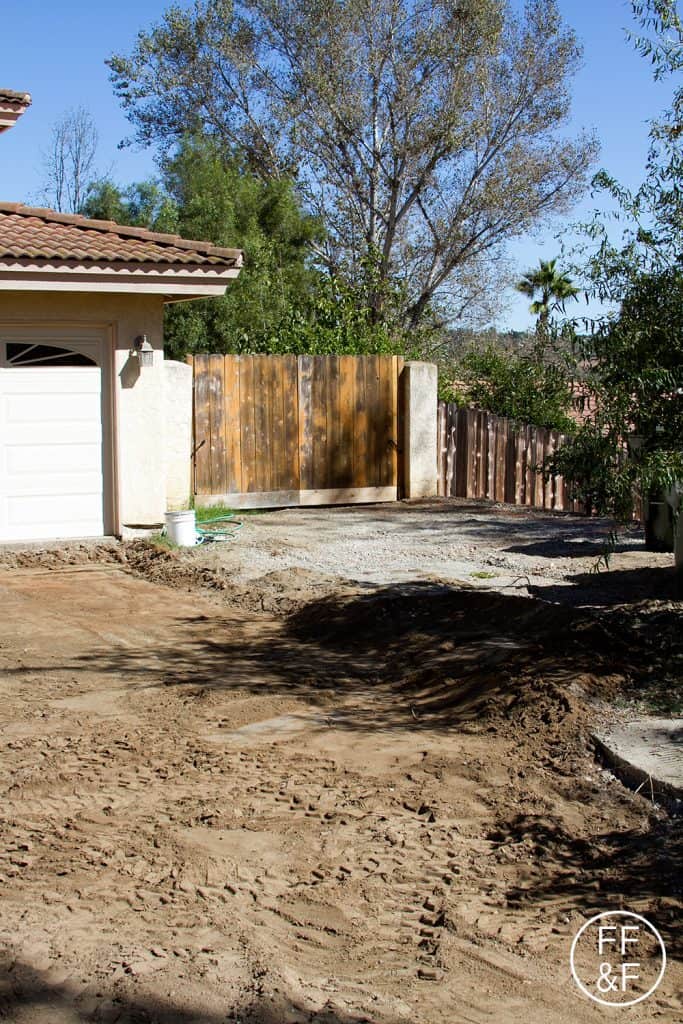 View during front yard renovations, of the future driveway and entrance to the side yard.