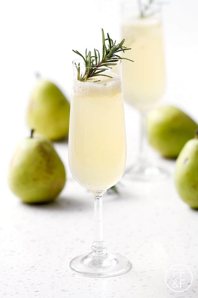 A Rosemary Pear Sparkler is a savory sweet mix of fresh herbs and sweet pears topped with sparkling wine or champagne.