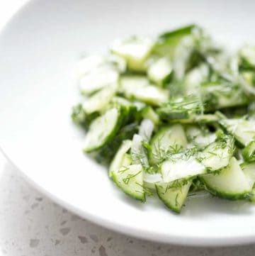 close up of bowl of cucumber dill salad