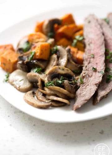 This Sheet Pan Steak Dinner is quick and easy with very little cleanup. This flank steak with mushrooms and sweet potatoes dish is one that your family will request again and again!
