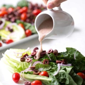 A simple recipe for an autoimmune protocol approved Mediterranean Salad. Romaine lettuce is the base for lots of onions, tomatoes, kalamata olives and homemade Mediterranean Salad Dressing. This recipe is allergy friendly (gluten, dairy, shellfish, nut, egg, and soy free) and suits the autoimmune protocol (AIP) and paleo diets.