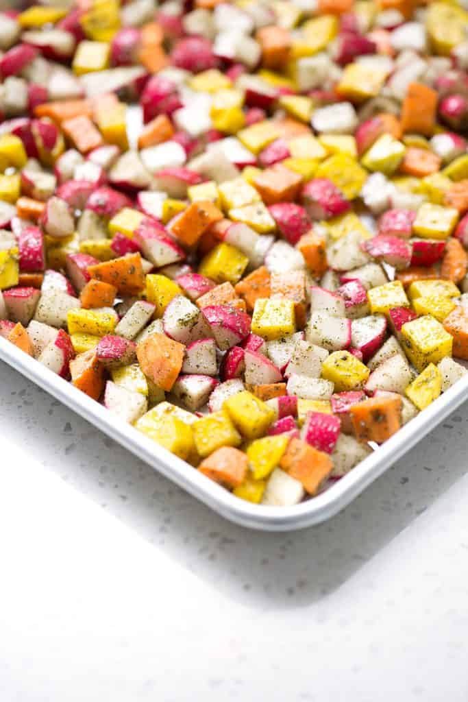 This recipe for Roasted Root Vegetables uses radishes, sweet potatoes and beets with just a few other ingredients to make a colorful and hearty veggie side dish. It’s time to make this dish an AIP veggie go-to for healthy, delicious and easy meals. This recipe is allergy friendly (gluten, dairy, shellfish, nut, egg, and soy free) and suits the autoimmune protocol (AIP) and paleo diets.