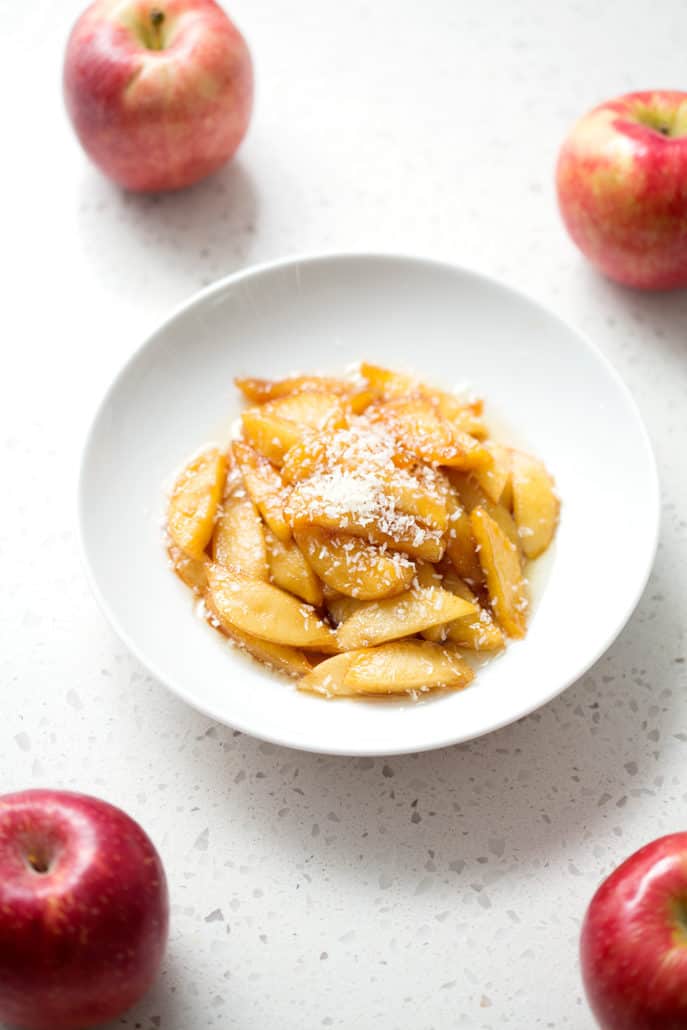 plate of caramelized apples surrounded by apples