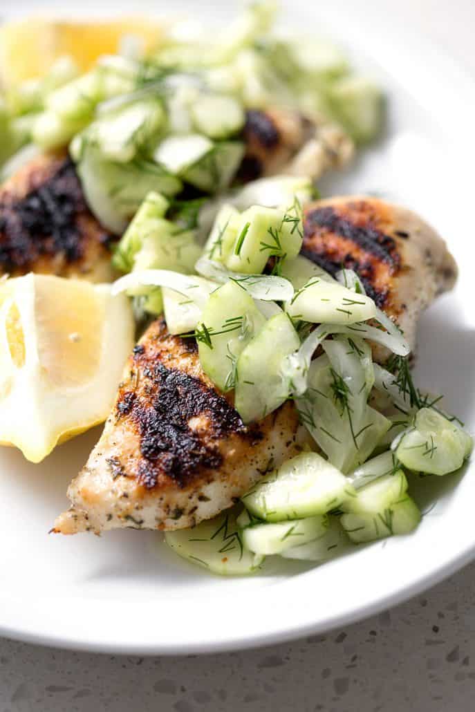 Grilled Chicken and Cucumber Dill Salad on white background