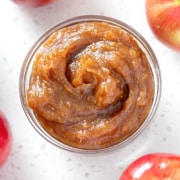 flat lay jar of apple butter and apples