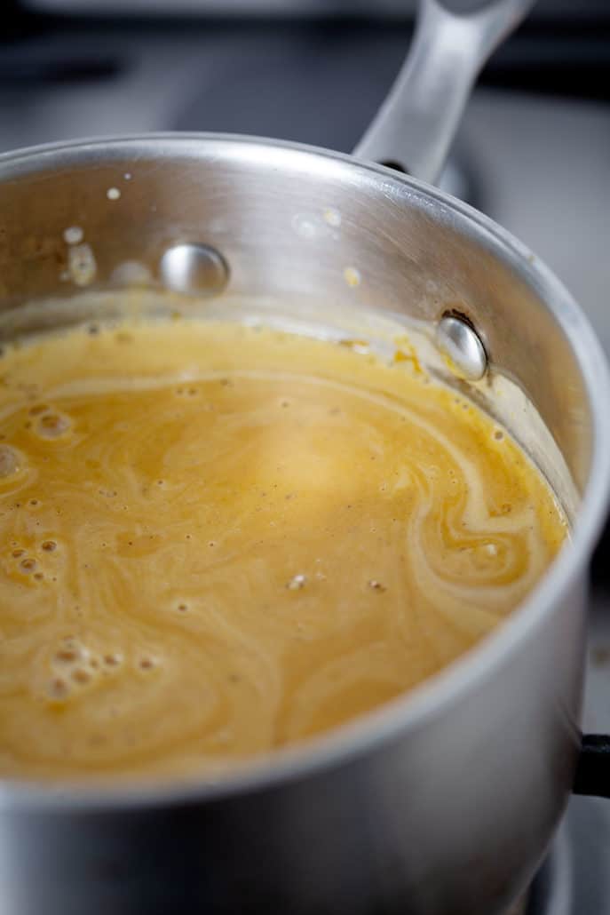 saucepan of pumpkin and coconut mixture on stovetop