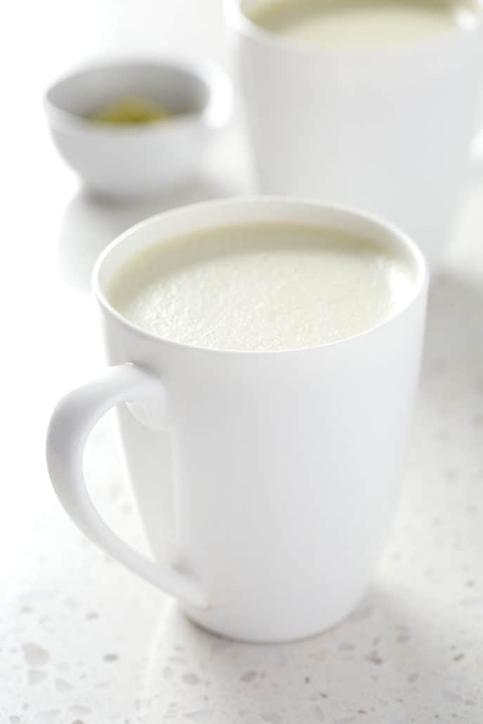 mugs of aip coconut milk matcha latte on what background