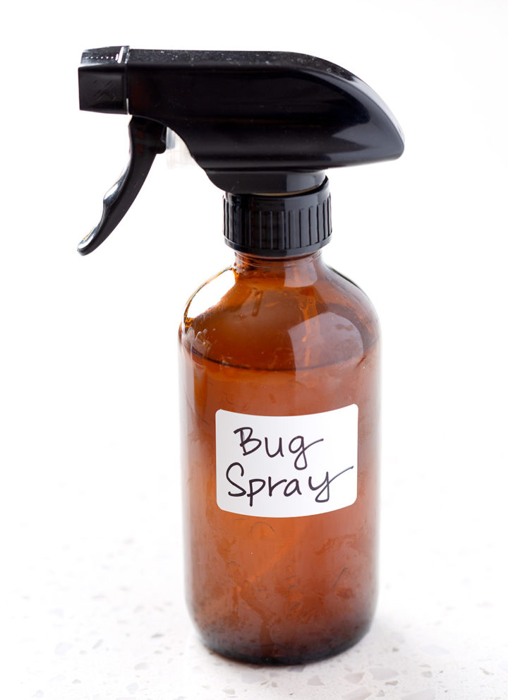 amber spray bottle with the words bug spray