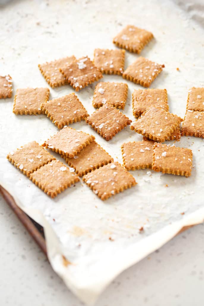 AIP Cassava 'Cheese' Crackers on parchment lined baking sheet